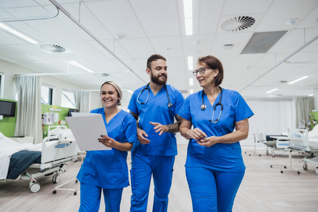 A group of people in blue scrubs Description automatically generated with medium confidence